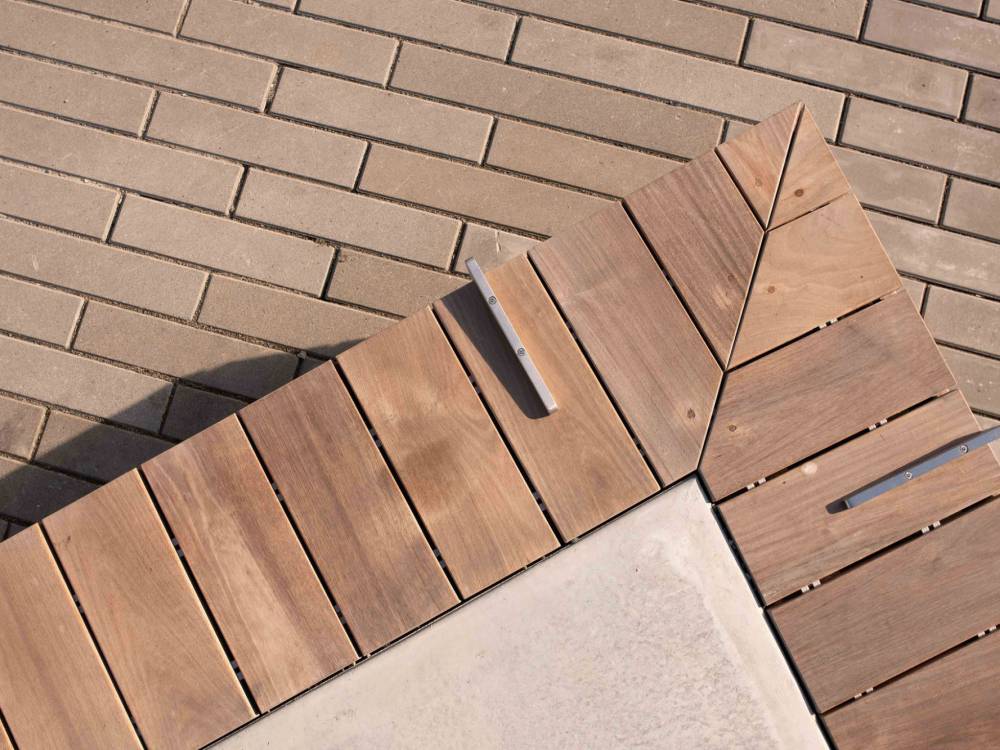 Close up of one of the wooden seats in the plaza.