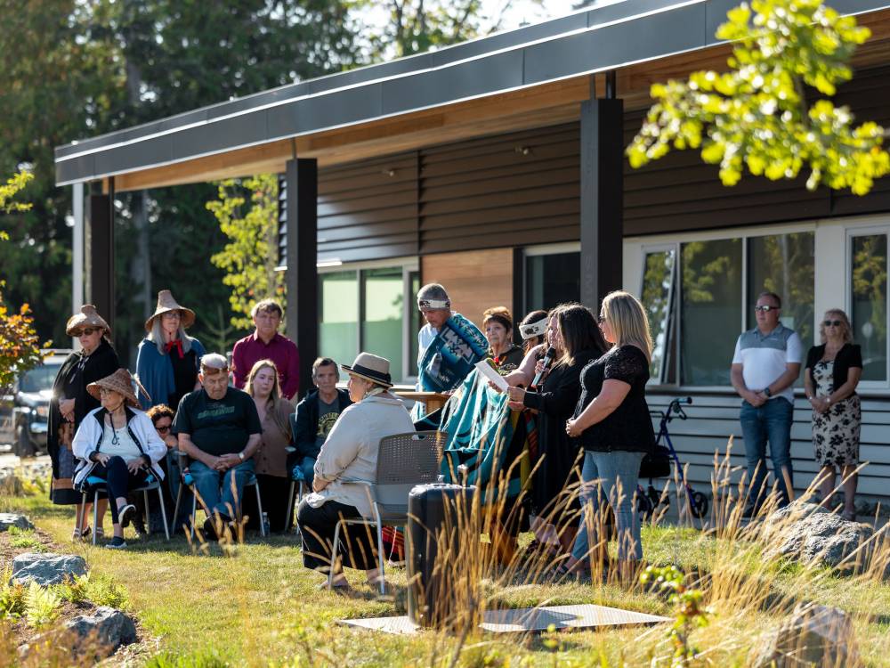 Photo of Nation members telling stories outside