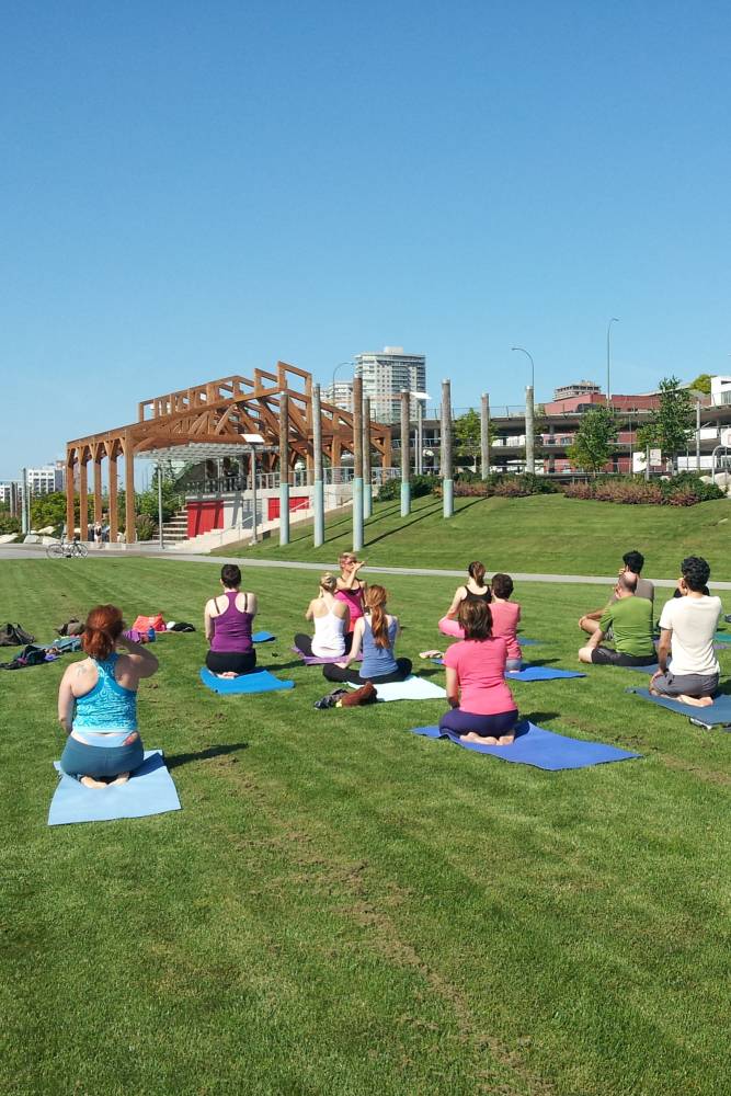 Yoga class in lawn at Westminster Pier Park.