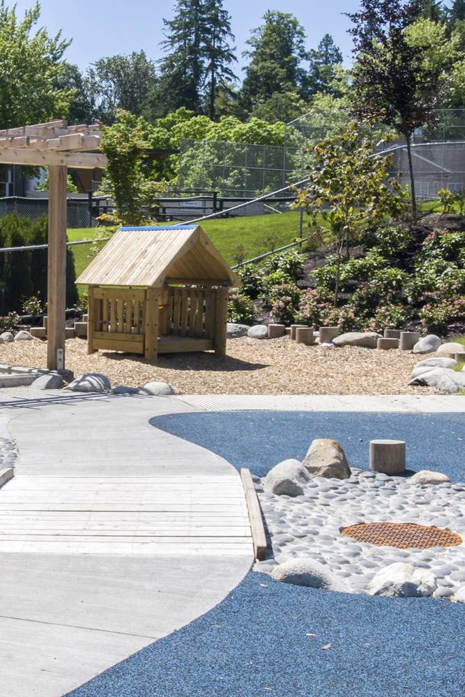 Photo of wooden play equipment at the park's playground.