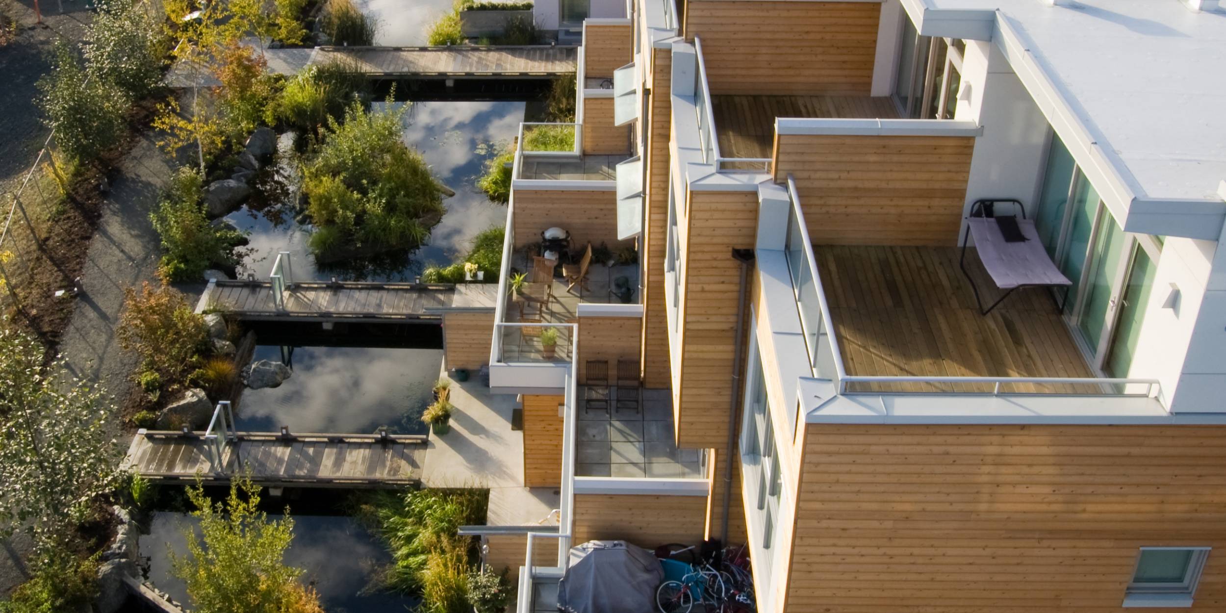 Aerial view of Dockside Green's residences and adjacent pond.