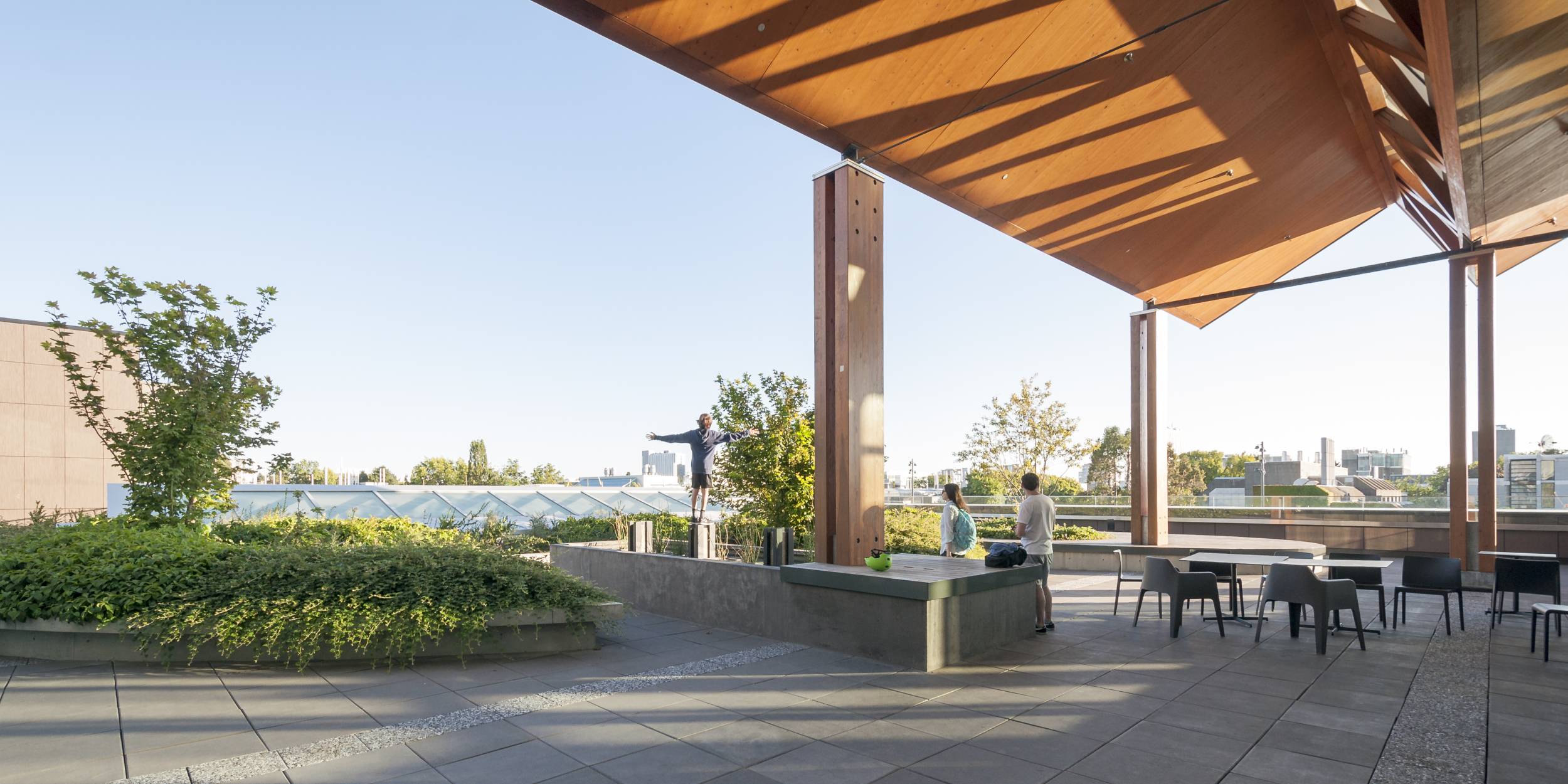 People relax at the UBC Nest rooftop.