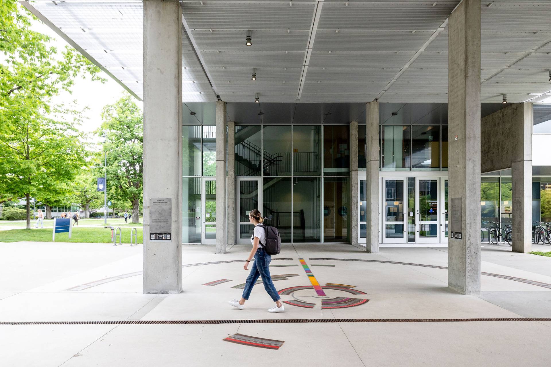 Photo of student walking past exhibit.