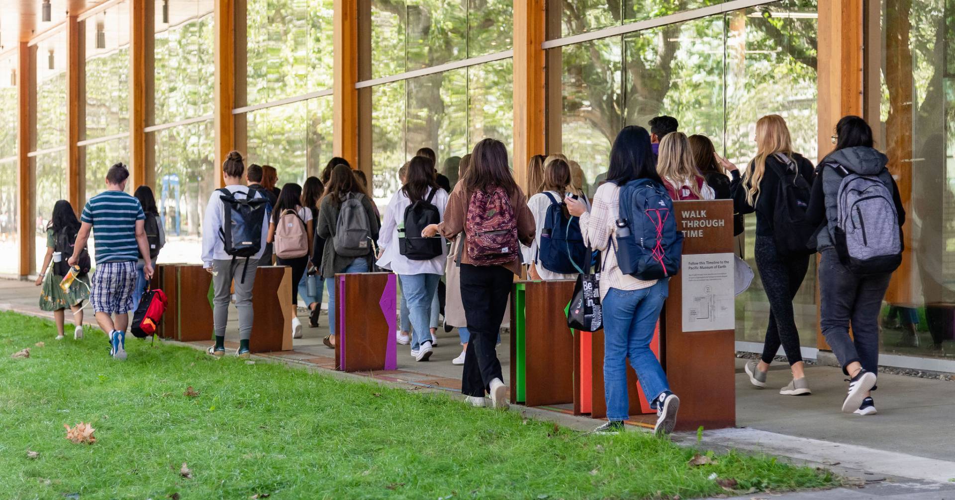 Students walk through the exhibit.